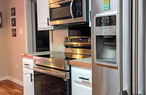 Russellville House | Enjoy the tranquil forest that surrounds this charming home in Dardanelle