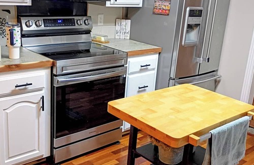 Russellville House | Enjoy the tranquil forest that surrounds this charming home in Dardanelle