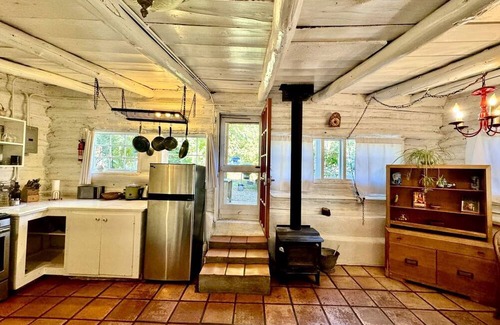 San Cristobal Cabin | Log Casita Overlooking Pond and Waterfall near Taos, New Mexico