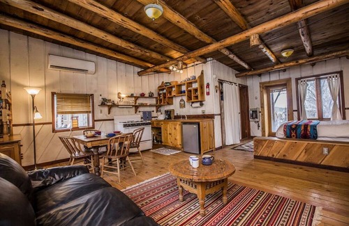 San Cristobal Cabin | Rustic Log Cabin on Eco-Friendly Farm near Taos, New Mexico