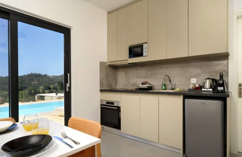Kavvadades Villa | Lavish Corfu Villa | Villa Elysian View | 1 Bedroom | Spacious Furnished Terrace with Shaded Outdoor Dining Area | Private Garden, Pool and Hot Tub | Prime Location | Arillas, Mega Lithari