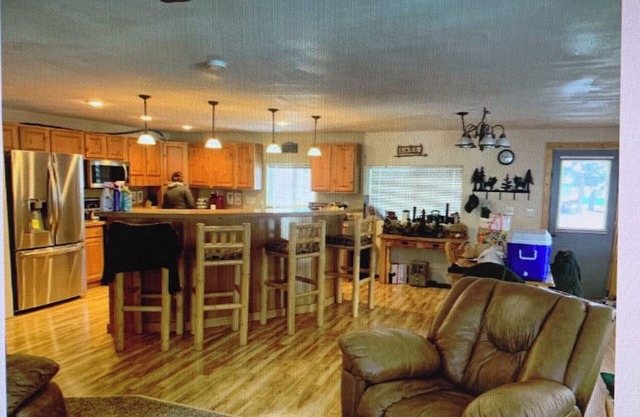 Cozy cabin on a quiet dead end street with a large deck and outdoor kitchen