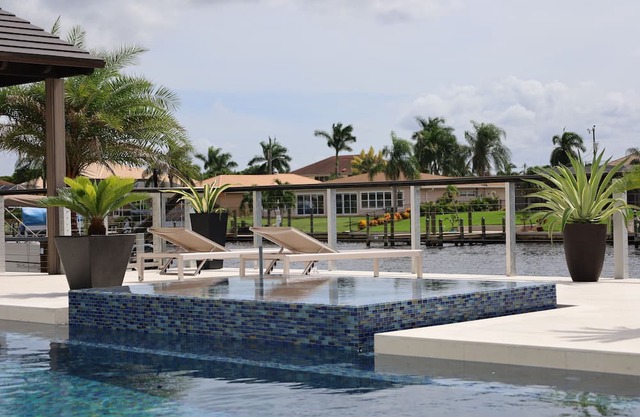 Custom Home with tile pool, boating dock and every comfort