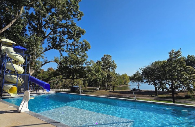 Giant10-bedroom lakefront home with large pool, hot tub, and dock