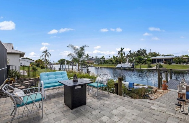 Paradise Awaits. Beautiful Home with Pool located on a canal with dock
