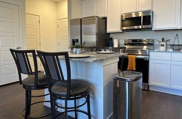 2 bedroom, 3 bath 2 car garage townhome with a short drive to everywhere