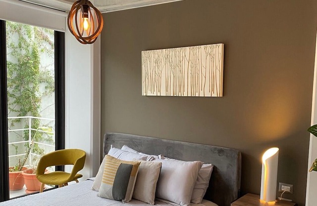 Luxury Cayala 2BR/2BA suite w/sunlit balcony near US Embassy, modern amenities.