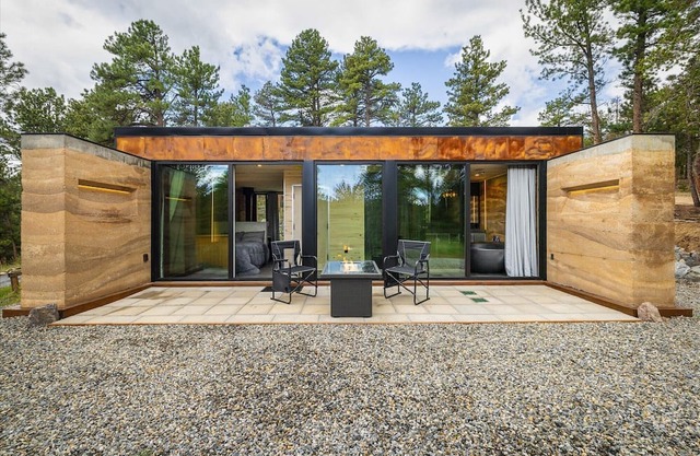 Earth-Built Cabin with Pine Shadows and a Tub That Waits