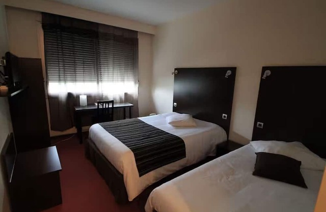 Enjoy a Peaceful Stay in Lyon with Comfortable Bedding and Amenities