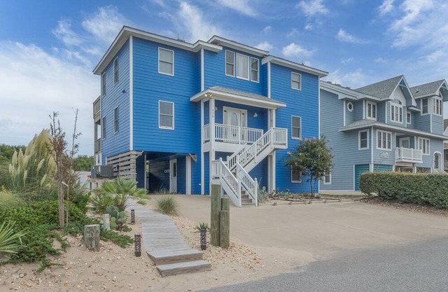 Experience luxury at 1861 - Into the Mystic, a spacious 6-bedroom oceanfront home in Corolla, NC.