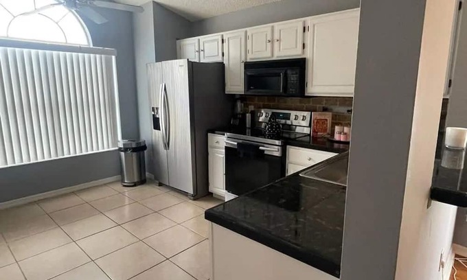 Esprit House | Spacious 4-bedroom house in delightful Davenport with WiFi, AC And Near Disney