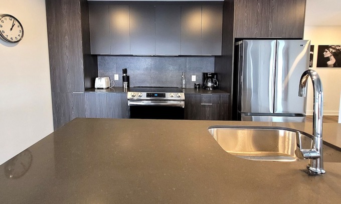 Fabreville Apartment | Corporate Stays - Luxurious 2BR with Stunning Rooftop Views Luxury & Gym Accessn