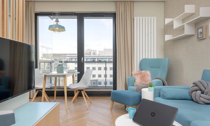 Mokotow Apartment | Bright Blue Apartment by Renters
