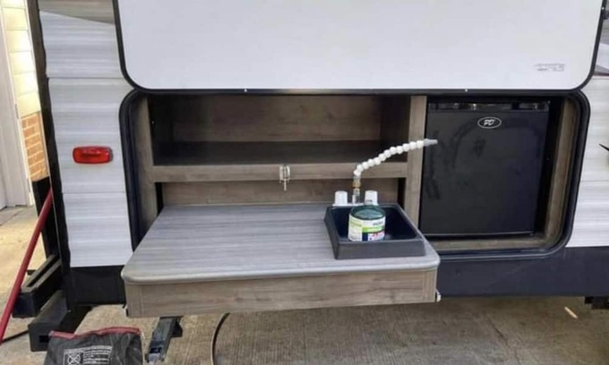 Aurora RV Rental | Camper located in campground! Walking distance to fishing!